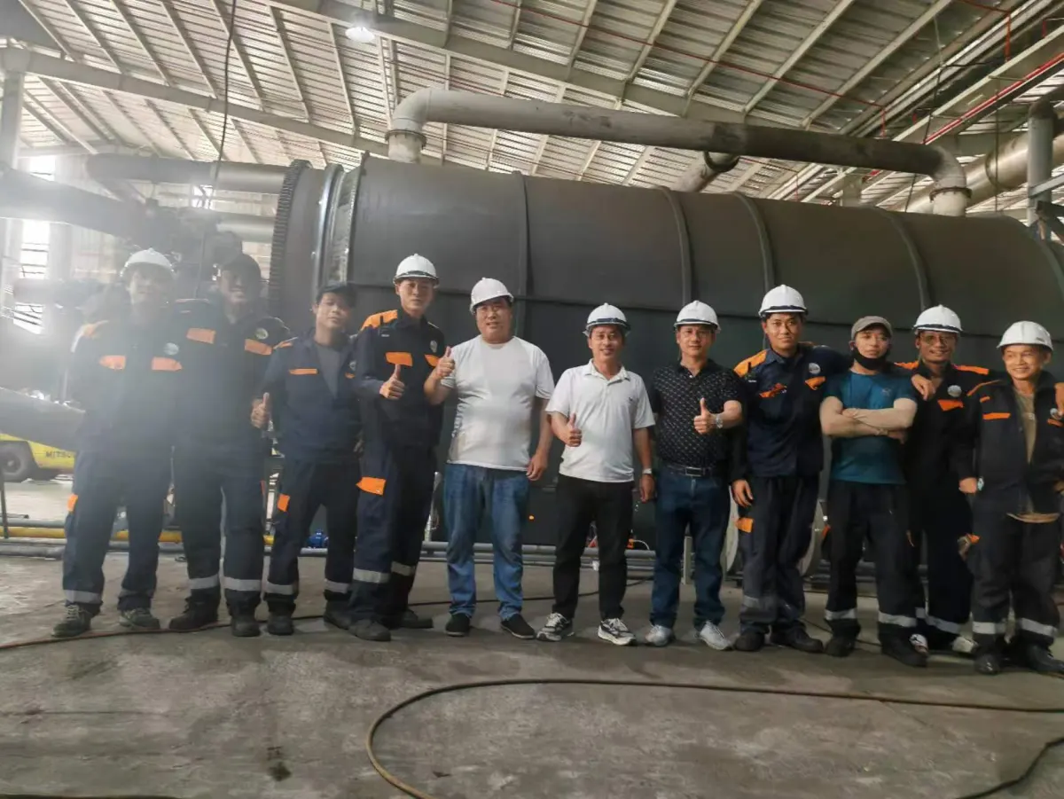 Commissioning team in front of reactor